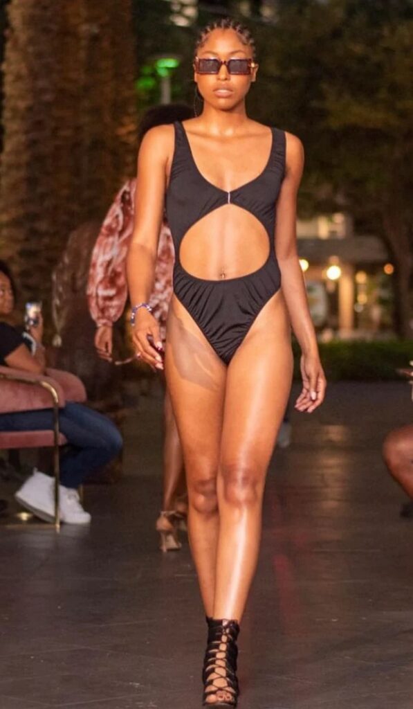 Key black one piece set photo courtesy OMA Boutique Model wearing Key black one piece set from OMA Swim collection